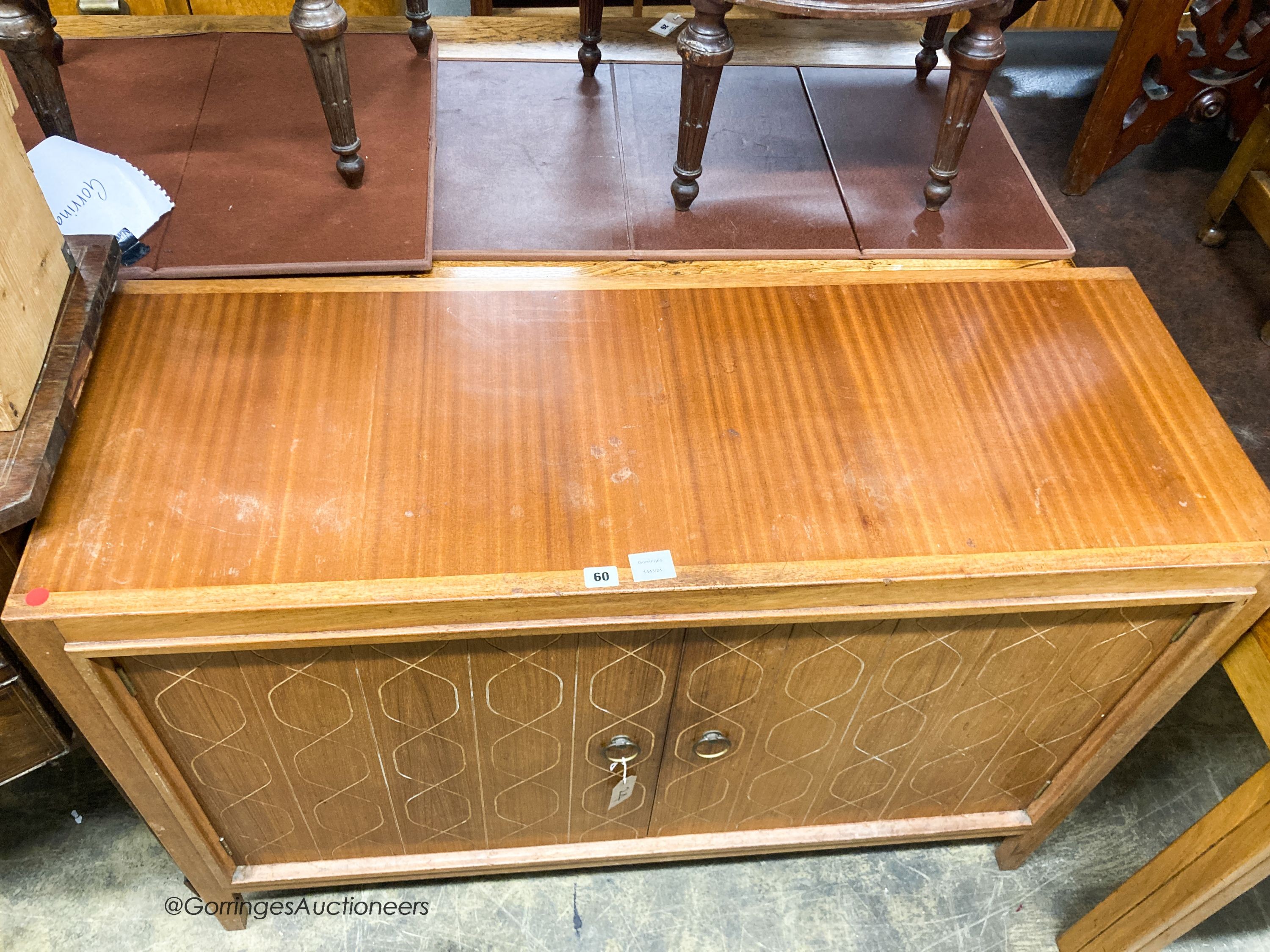 A Gordon Russell teak matrix side cabinet, W.122cm D.46cm H.84cm